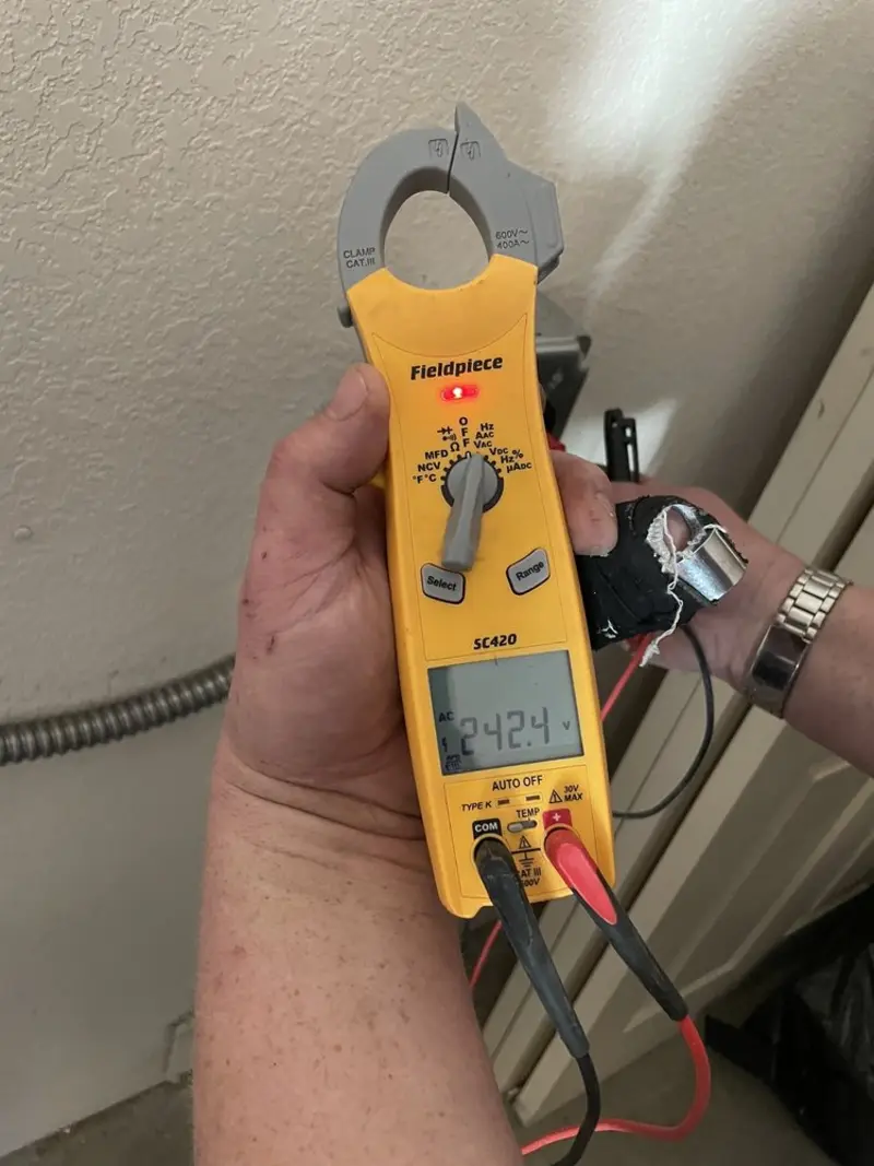 Voltage testing with clamp meter during Electrical Installation Services in Kenmore